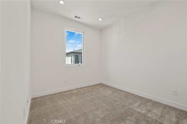 empty room featuring light colored carpet