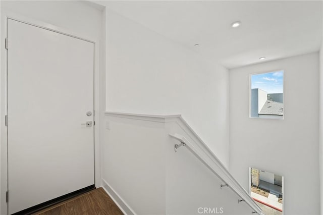 staircase featuring hardwood / wood-style flooring