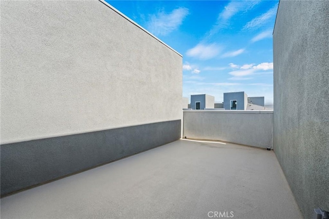 view of patio featuring a balcony