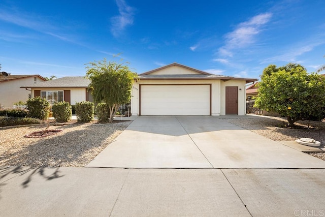 ranch-style home featuring a garage