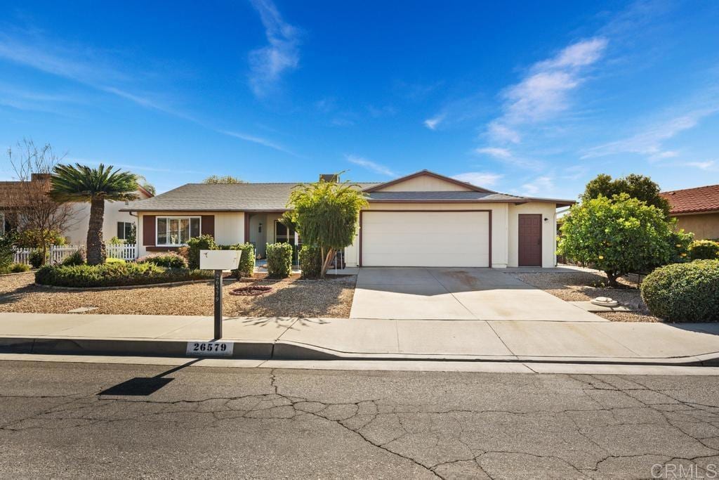 single story home featuring a garage