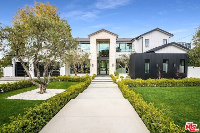 view of front of property with a front lawn