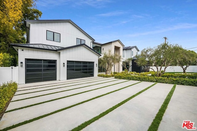 modern farmhouse featuring a garage