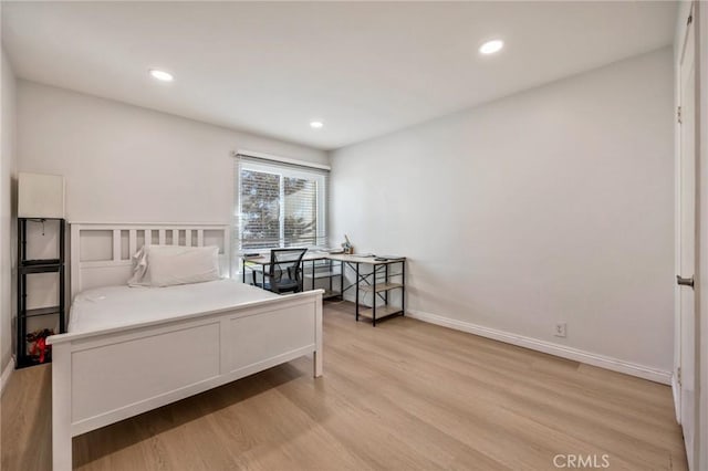 bedroom featuring light hardwood / wood-style floors