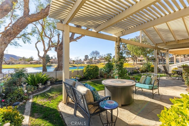 view of patio / terrace featuring a water and mountain view, a fire pit, and a pergola