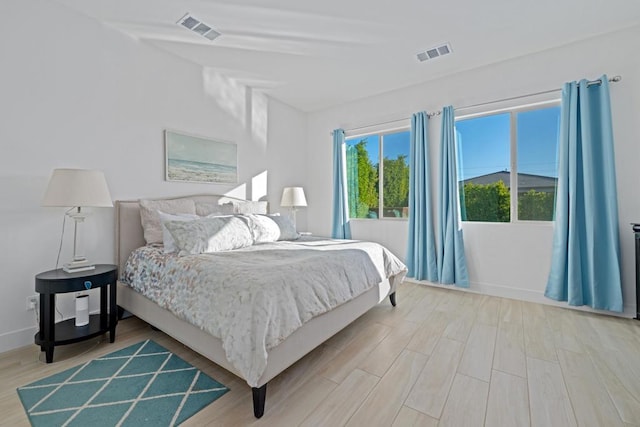 bedroom with light hardwood / wood-style floors