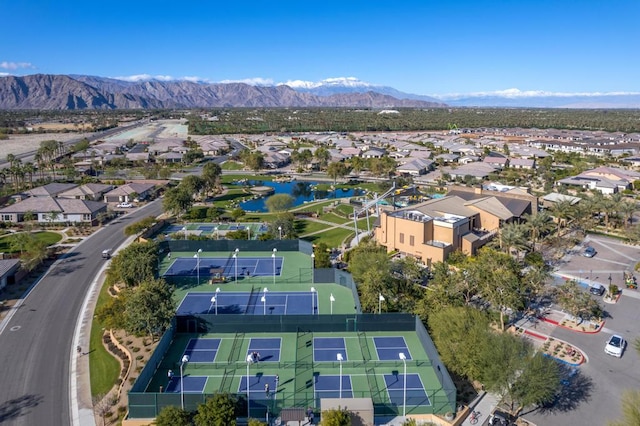 birds eye view of property featuring a water and mountain view