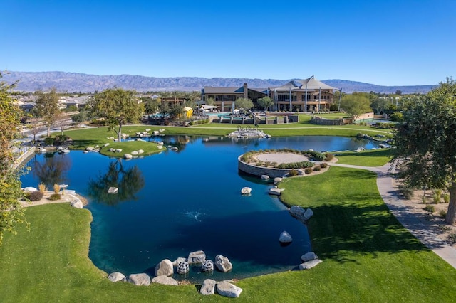 bird's eye view with a water and mountain view