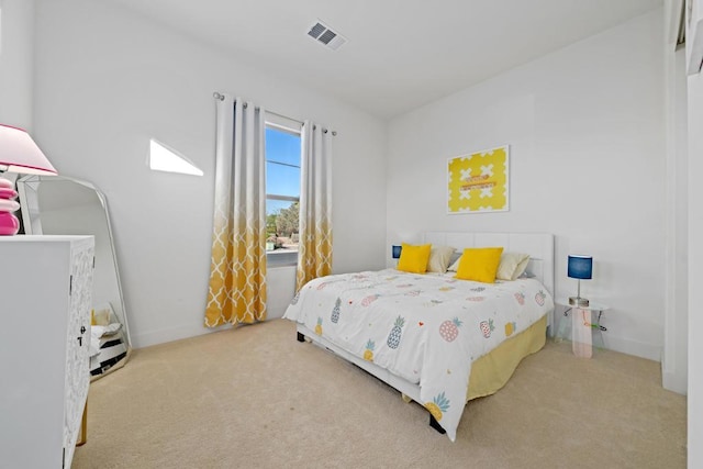 bedroom featuring light colored carpet