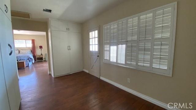 foyer entrance with dark hardwood / wood-style flooring