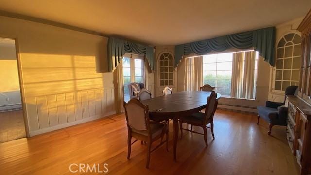 dining area with wood-type flooring