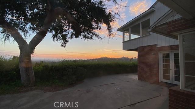 patio terrace at dusk with french doors