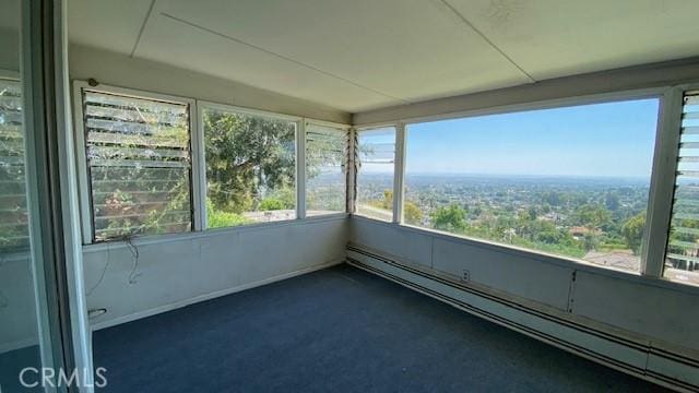 unfurnished sunroom featuring a baseboard radiator