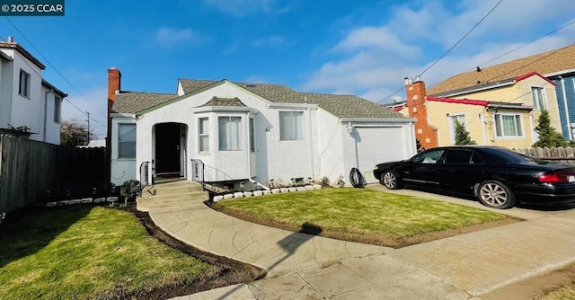 bungalow-style home with a garage and a front yard