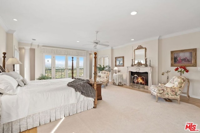 bedroom with ceiling fan, access to exterior, light carpet, and ornamental molding