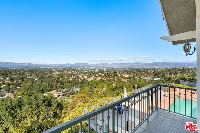 balcony featuring a mountain view