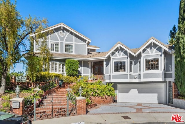 tudor-style house with a garage