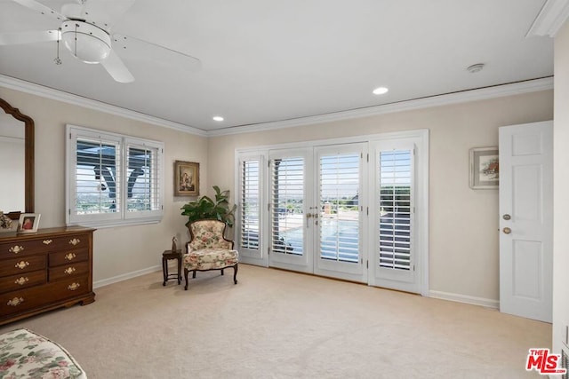 living area featuring ceiling fan, crown molding, light colored carpet, and french doors