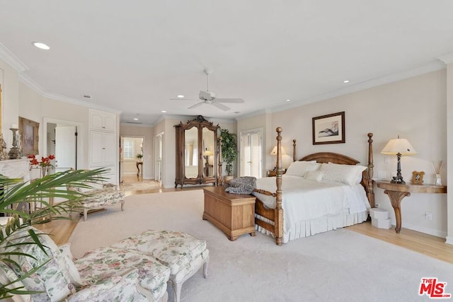 bedroom featuring ceiling fan, light hardwood / wood-style floors, and crown molding