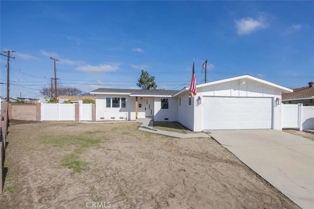 single story home with a garage, fence, driveway, stucco siding, and board and batten siding