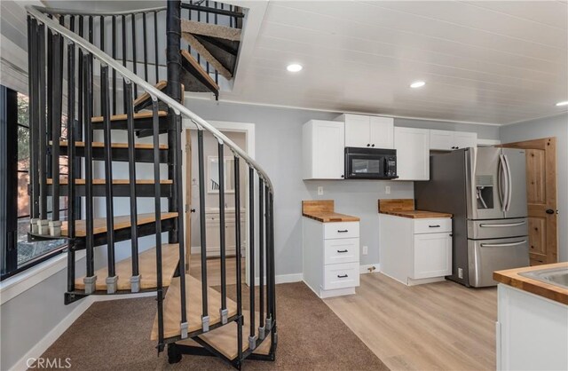 stairs with hardwood / wood-style floors