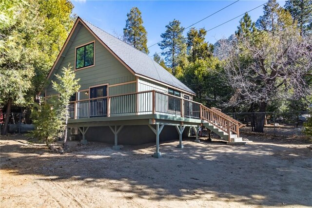 rear view of property with a deck