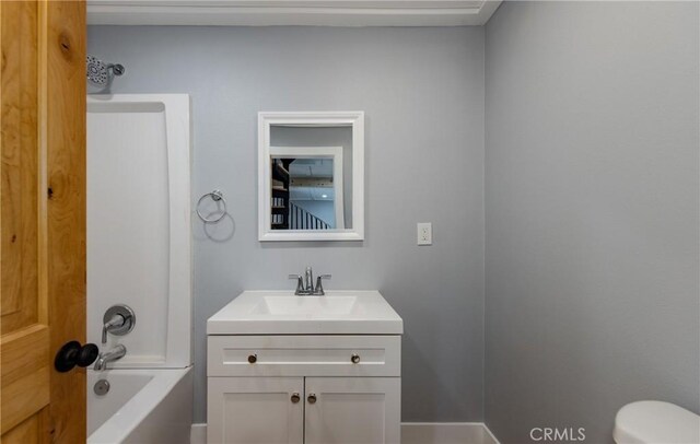 full bathroom featuring toilet, vanity, and shower / bathing tub combination