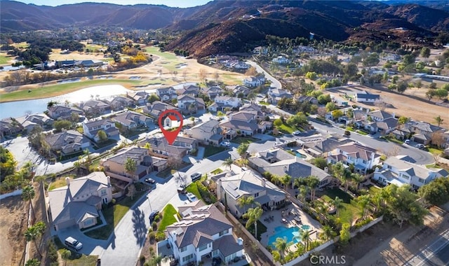 birds eye view of property with a mountain view