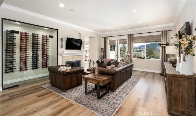 living room featuring hardwood / wood-style floors and ornamental molding