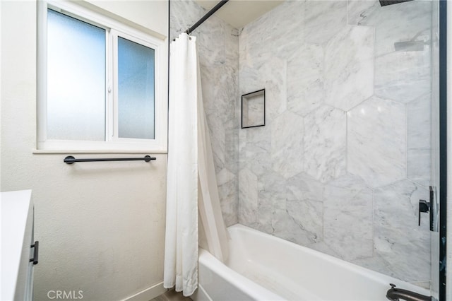 bathroom with shower / bath combo