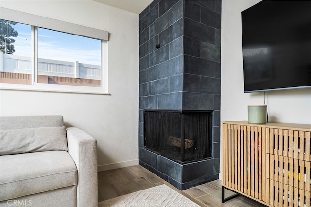 living room with a tiled fireplace