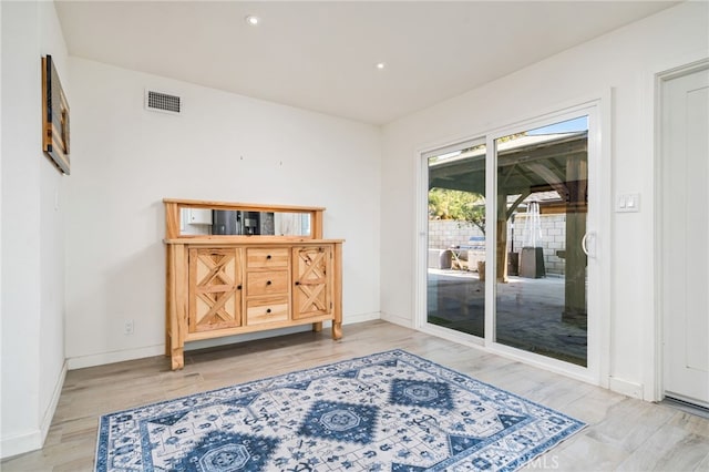 doorway with light hardwood / wood-style floors