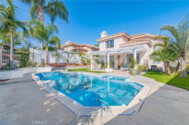 view of swimming pool with a patio area and a pergola