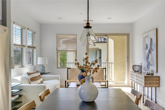 dining room with a notable chandelier and hardwood / wood-style floors