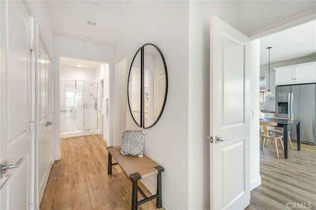 hall featuring light hardwood / wood-style floors