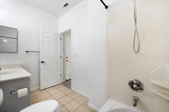 full bathroom featuring toilet, tile patterned floors, vanity, and  shower combination