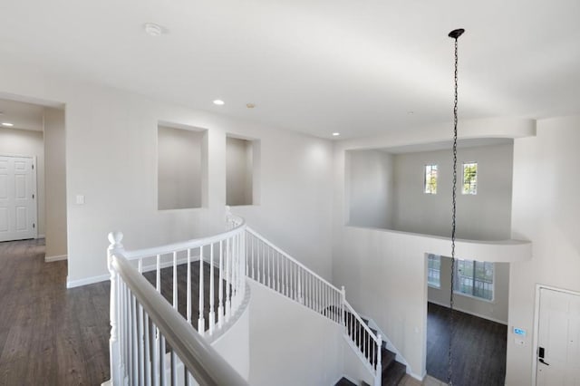 corridor featuring dark hardwood / wood-style flooring