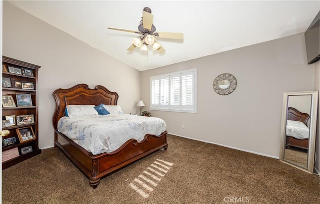 carpeted bedroom featuring ceiling fan and vaulted ceiling