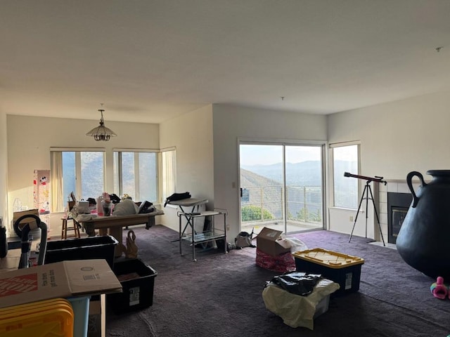 carpeted living room with a mountain view