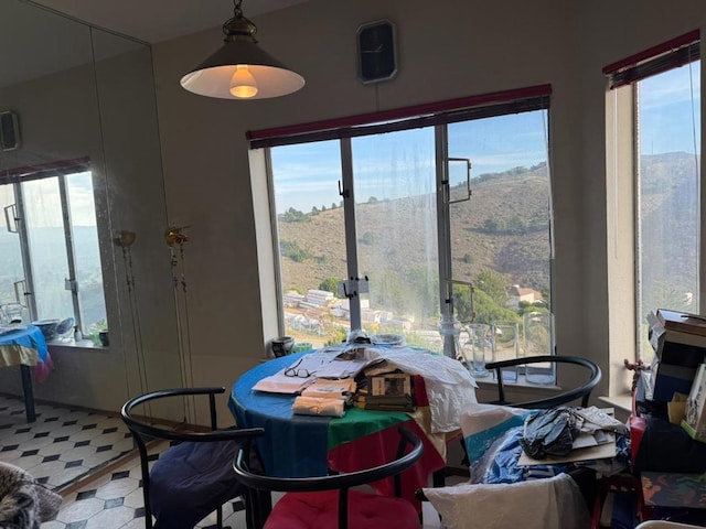 dining space with a mountain view and plenty of natural light