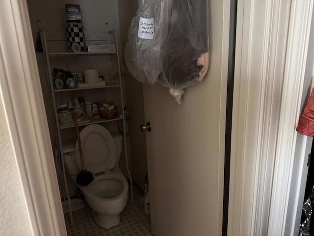 bathroom with tile patterned floors and toilet