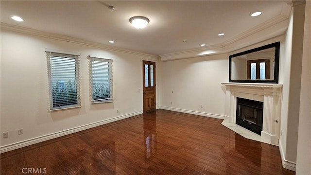 unfurnished living room featuring crown molding