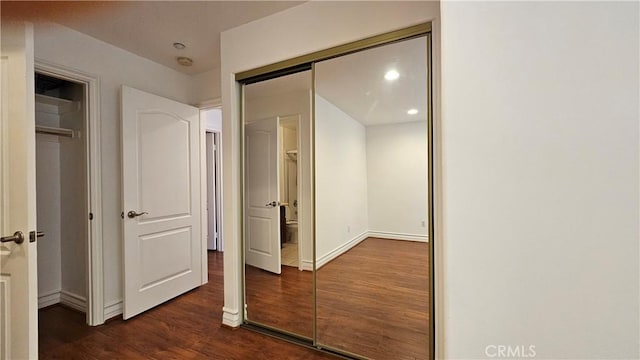 hall with dark hardwood / wood-style floors