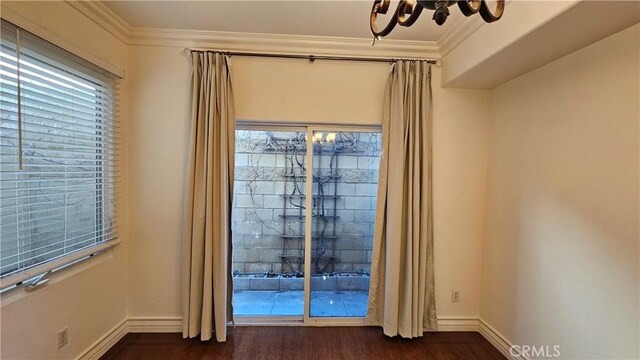 interior space featuring ornamental molding and hardwood / wood-style floors