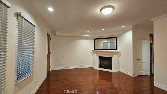 unfurnished living room with dark hardwood / wood-style floors and ornamental molding