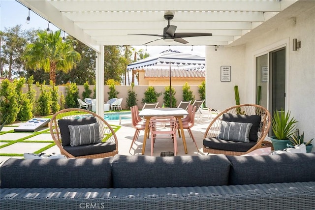 view of patio featuring ceiling fan, a fenced in pool, an outdoor living space, and a pergola