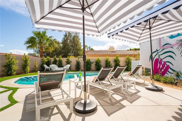 view of patio / terrace featuring a fenced in pool