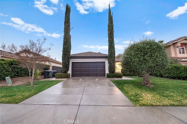 view of front of house with a garage and a front lawn