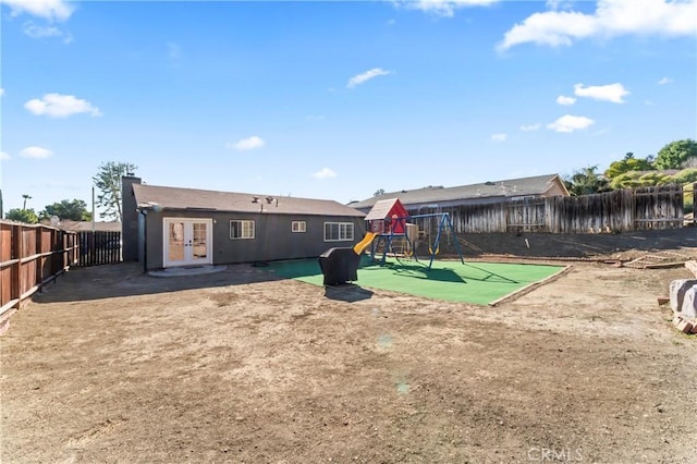 exterior space featuring a playground and french doors