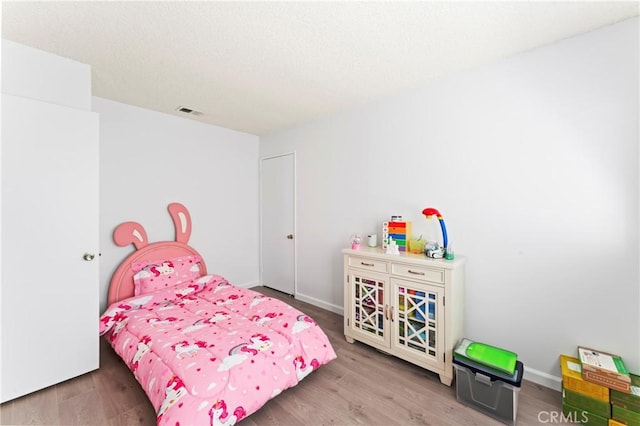 bedroom featuring hardwood / wood-style floors